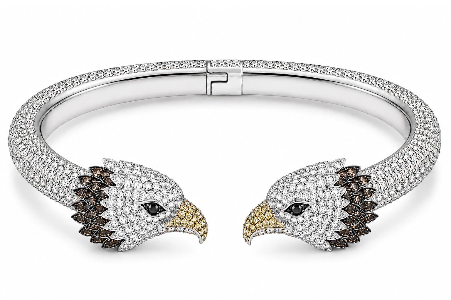 Fly High, an open cuff in white gold with eagle-head terminals, a white diamond band, cognac diamonds, and yellow sapphires on the beaks, photographed on seamless white.